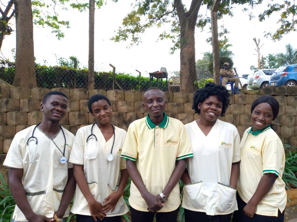 The Moriah Healthcare team in branded uniforms, Kampala