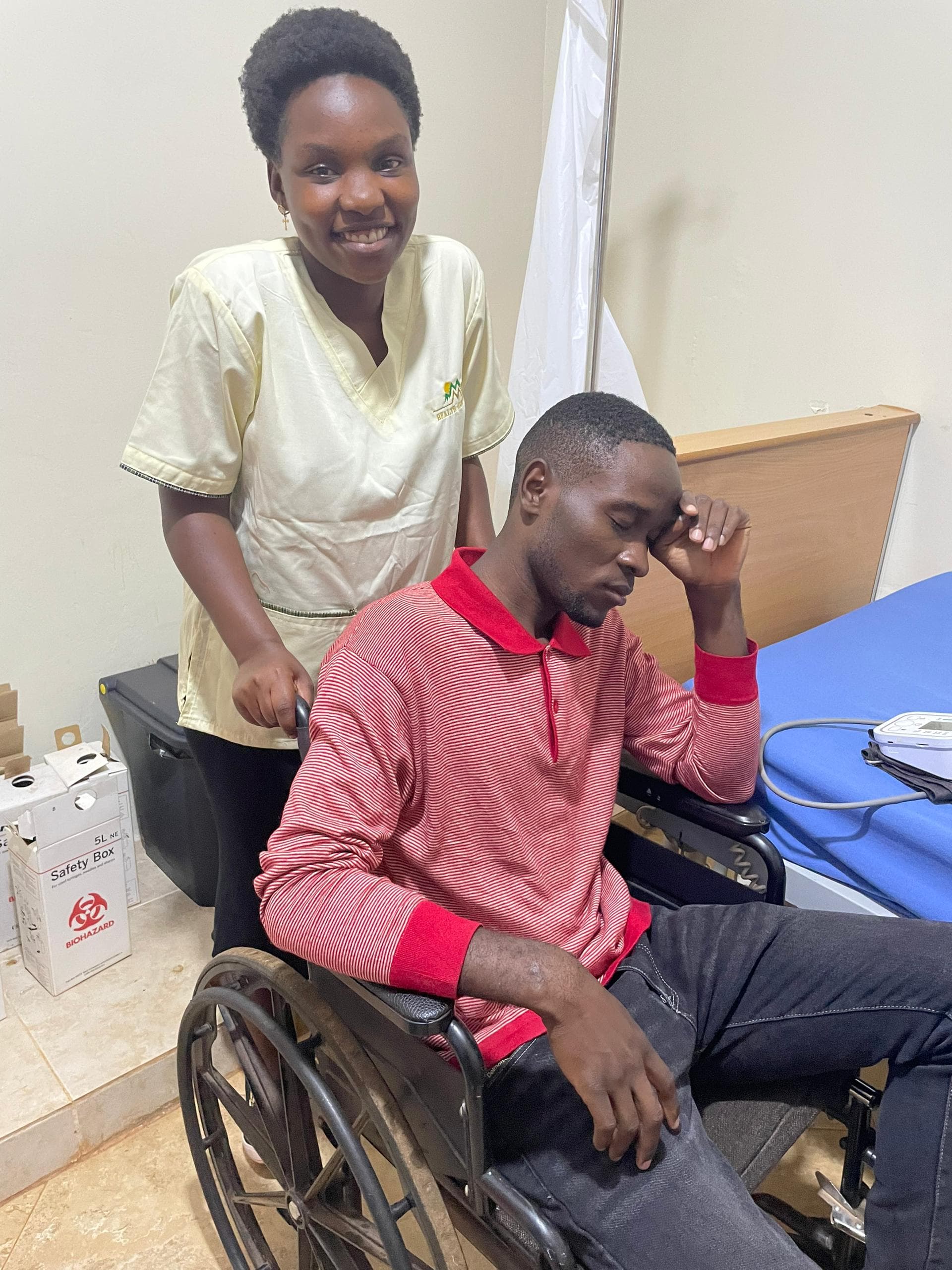 A Moriah carer caring for a patient — Kampala